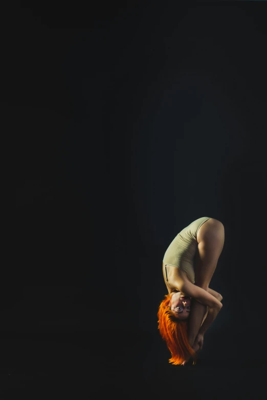 a woman doing a handstand in the dark, a portrait, by Elizabeth Polunin, studio medium format photograph, ( redhead, various posed, square