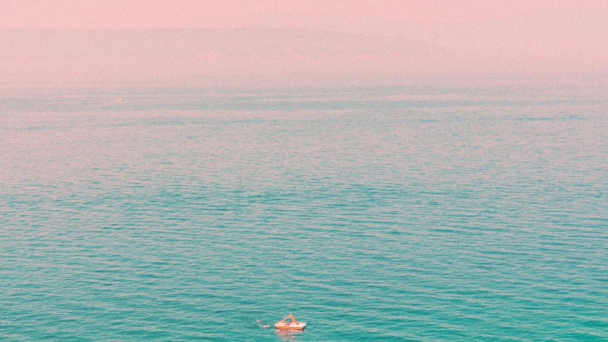 a small boat floating in the middle of a large body of water, inspired by Elsa Bleda, pink white turquoise, instagram photo, the dead sea, wes anderson color scheme