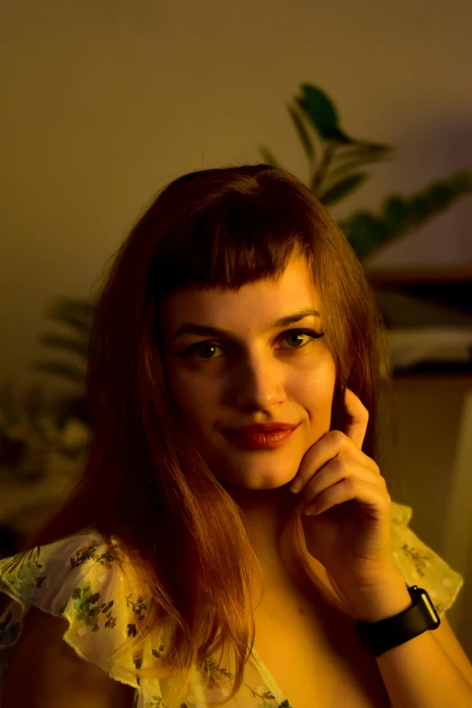 a woman sitting in front of a laptop computer, an album cover, inspired by Elsa Bleda, reddit, lovingly looking at camera, soft evening lighting, profile image, ((portrait))