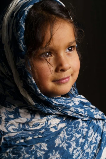 a young girl wearing a blue and white scarf, a picture, shutterstock contest winner, arabesque, an olive skinned, portrait”
