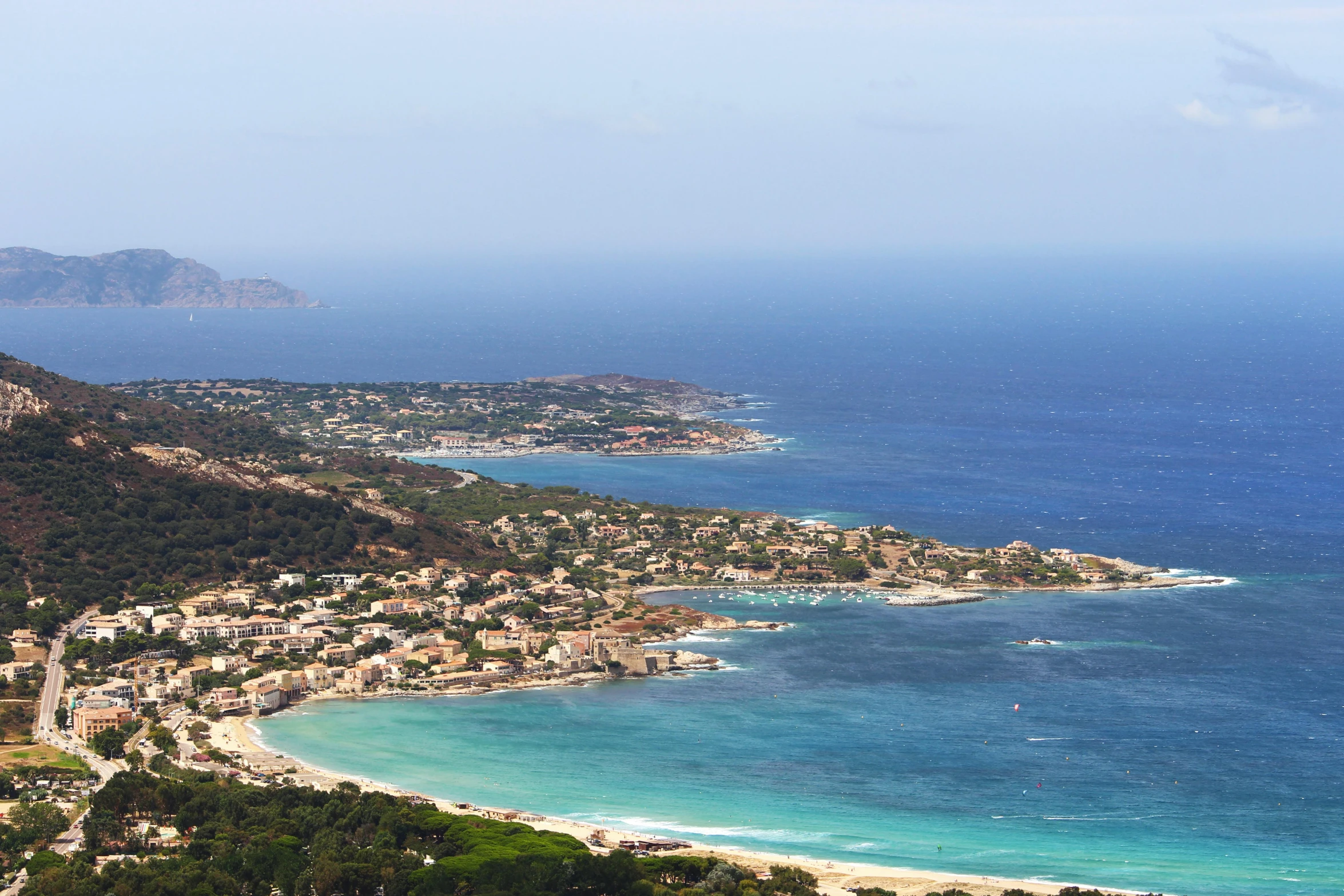 a large body of water next to a lush green hillside, pexels contest winner, renaissance, traditional corsican, soft-sanded coastlines, the sea seen behind the city, slide show