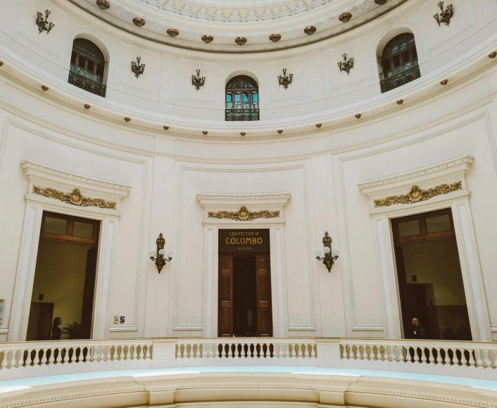 a large white building with a skylight above it, by Alejandro Obregón, unsplash contest winner, neoclassicism, lecture halls and gambling dens, inside a dome, many doorways, profile image