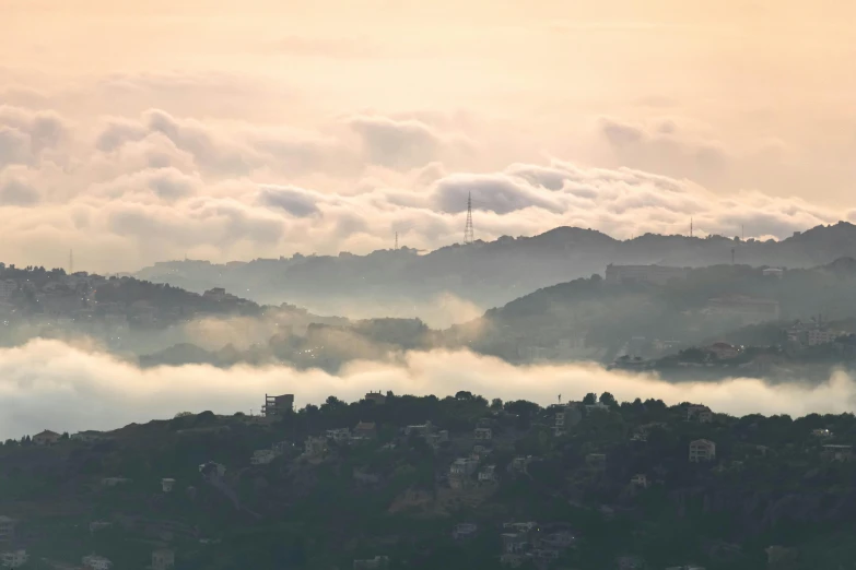 a plane flying over a lush green hillside, a matte painting, pexels contest winner, romanticism, city fog, guwahati, foggy at dawn, photograph of san francisco