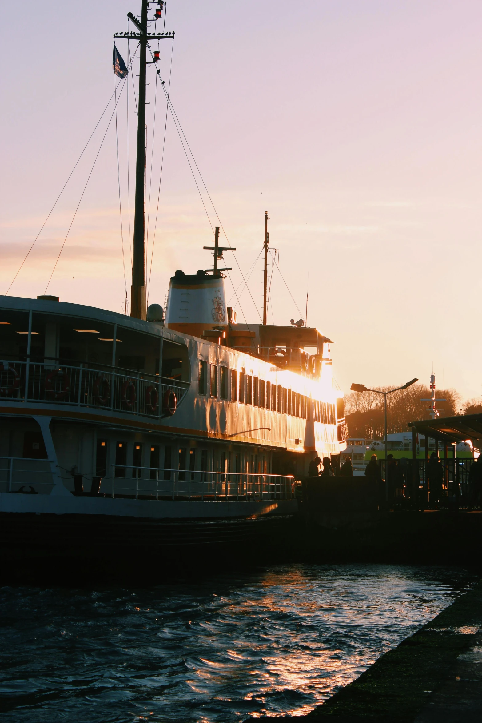 a boat that is sitting in the water, inspired by Wilhelm Marstrand, unsplash, happening, in savannah, warm glow, steamboat willy, docked at harbor