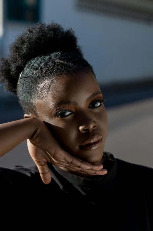 a close up of a person with a cell phone, afrofuturism, with dark hair tied up in a bun, square, photo from a promo shoot, proud looking away