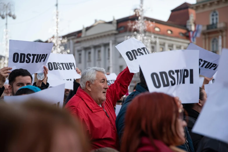 a group of people holding signs in the air, a photo, shutterstock, antipodeans, of an old man, istván sándorfi, ots shot, profile image