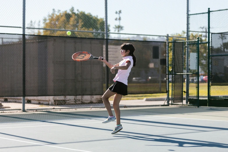 a woman swinging a tennis racquet on a tennis court, unsplash, american barbizon school, fall season, square, tx, low quality photo