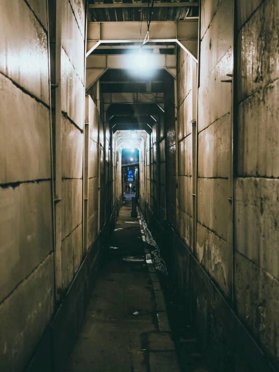 a long hallway with a light at the end of it, an album cover, inspired by Elsa Bleda, unsplash contest winner, brutalism, deserted shinjuku junk town, sewers, photo taken at night, trending on vsco