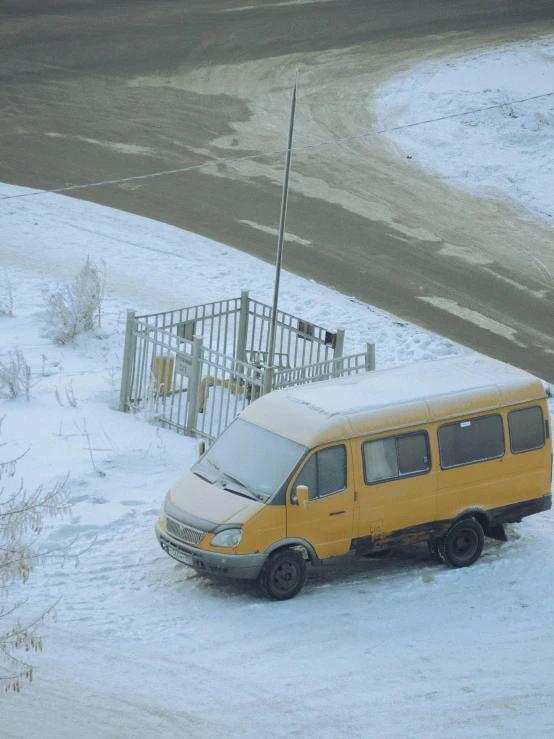 a van that is sitting in the snow, by Attila Meszlenyi, detention centre, 8k 28mm cinematic photo, 10k, late 2000’s