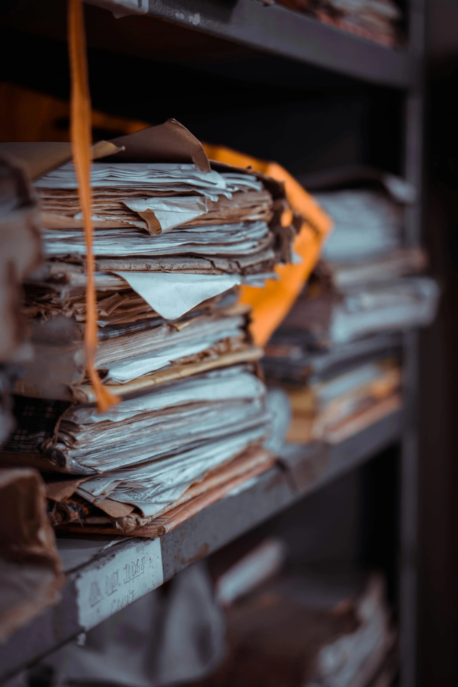 a stack of papers sitting on top of a wooden shelf, by Jesper Knudsen, unsplash, private press, inside a decayed surgical room, inspect in inventory image, dusty library, profile picture