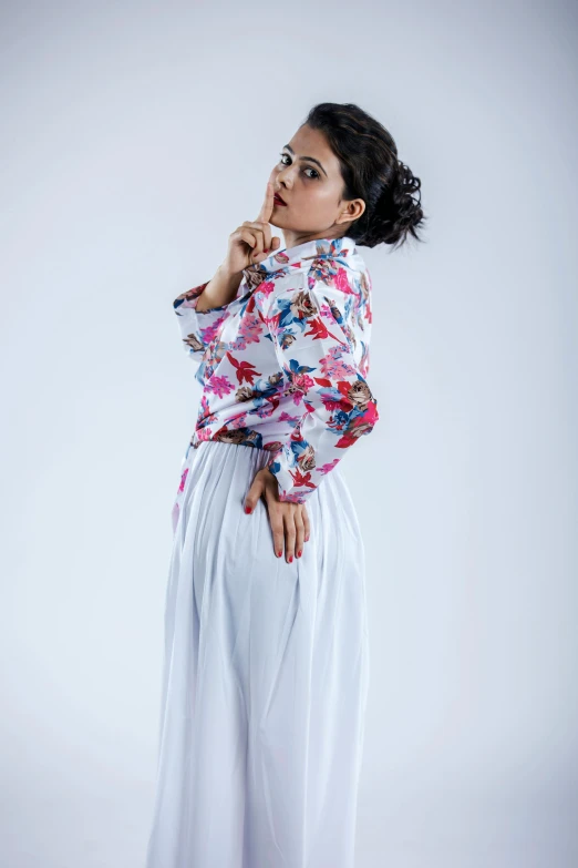 a woman standing and talking on a cell phone, an album cover, by Basuki Abdullah, studio shooting, wearing a blouse, white and pink, 15081959 21121991 01012000 4k