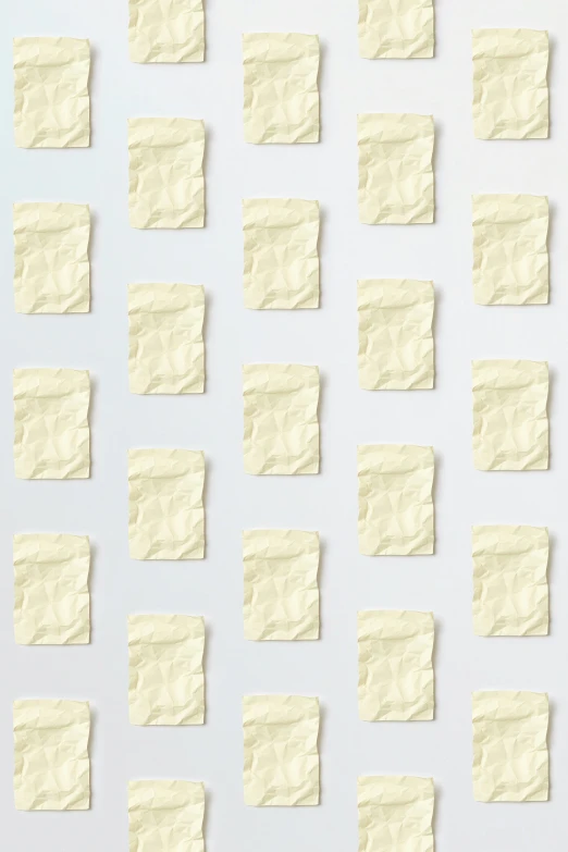 a bunch of sticky notes sitting on top of a white surface, inspired by Rachel Whiteread, conceptual art, french fry pattern ambience, computer wallpaper, light cream and white colors, paper crumpled texture
