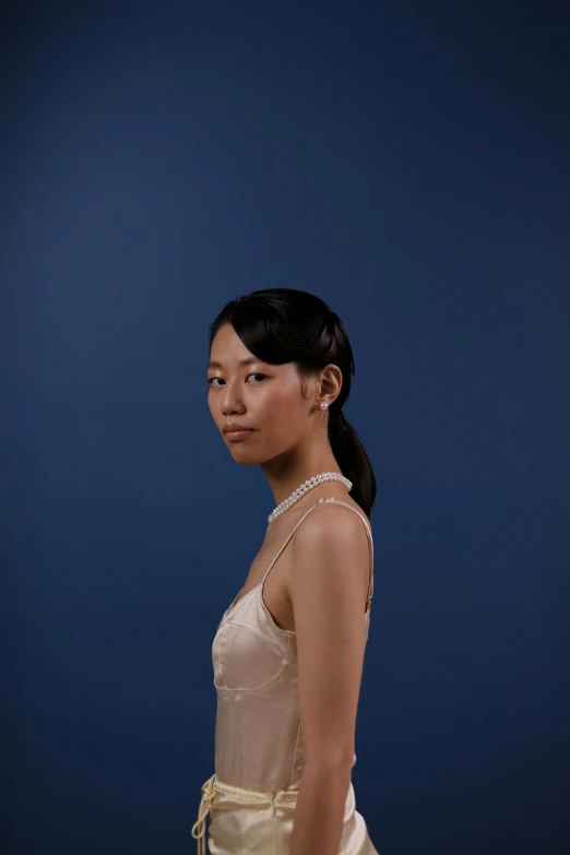 a woman in a white dress posing for a picture, an album cover, inspired by Feng Zhu, unsplash, hyperrealism, halfbody headshot, ethnicity : japanese, shot at dark with studio lights, light blue dress portrait