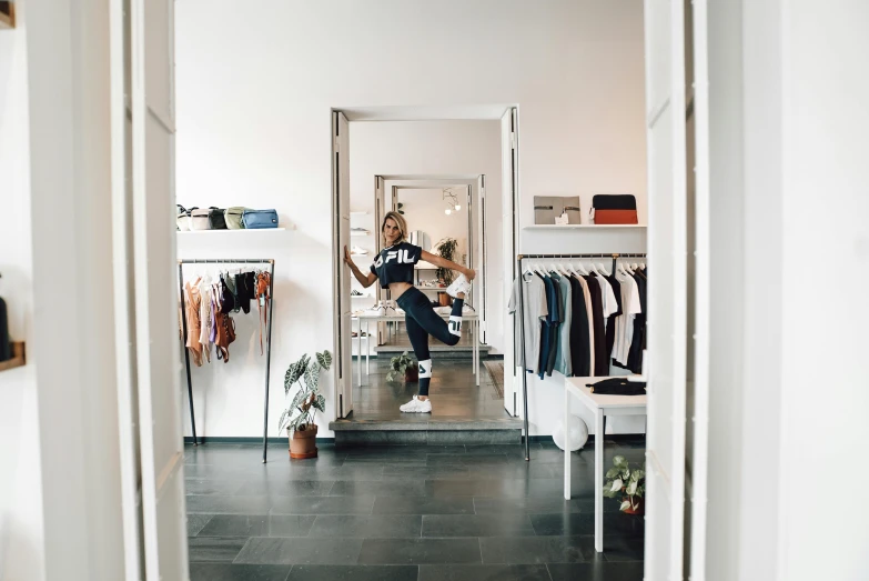 a person sitting on a chair in a room, exiting store, leaping with arms up, woman in streetwear, profile image