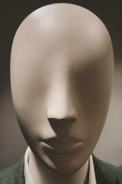 a mannequin head wearing a suit and tie, by Doug Ohlson, conceptual art, brancusi, white porcelain skin, facial features ), close - up photograph