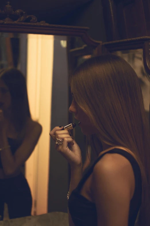 a woman brushing her teeth in front of a mirror, inspired by Elsa Bleda, pexels contest winner, happening, girl with brown hair, nighttime scene, 💋 💄 👠 👗, making out