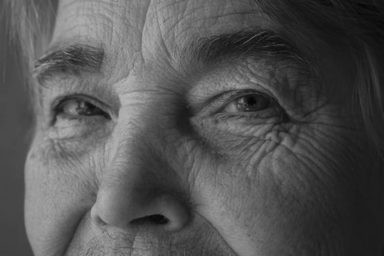 a black and white photo of a woman's face, inspired by Dorothea Lange, pixabay, photorealism, wise old man, closeup at the faces, bushy grey eyebrows, dementia