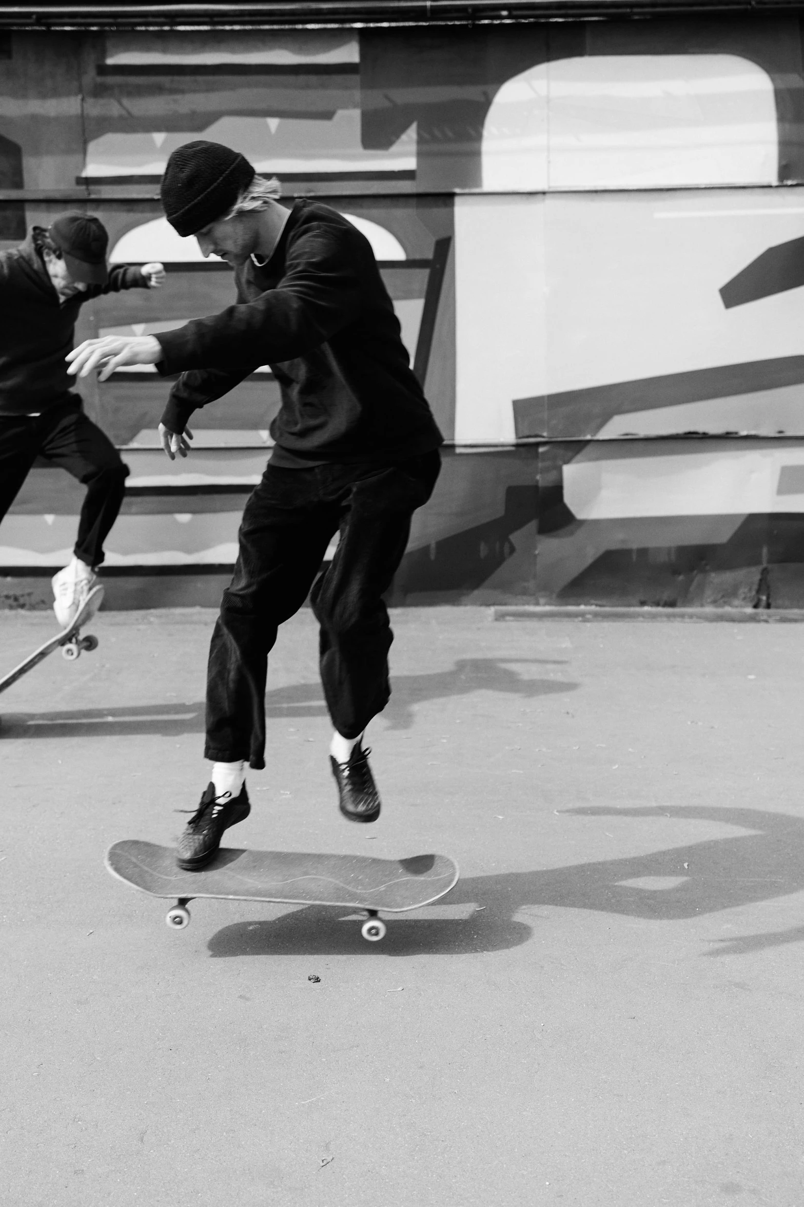 a black and white photo of a man on a skateboard, vitaly bulgarov and mike nash, in the style of sifu 🔥 😎 🕹️ 👀 :2, live-action archival footage, van