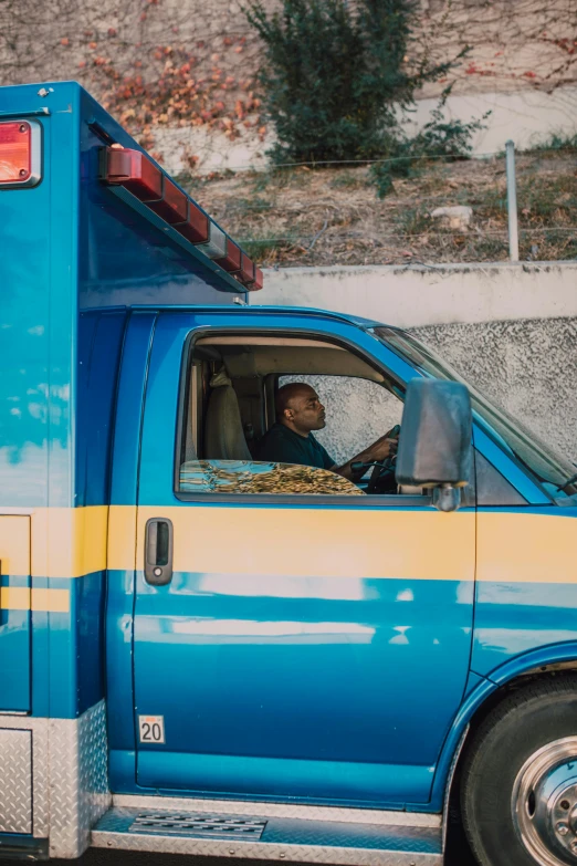 a blue ambulance parked on the side of the road, pexels contest winner, renaissance, photo of a man, square, diverse, ashteroth