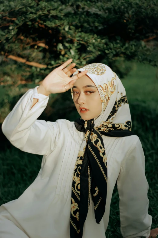 a woman in a white shirt and black scarf, a colorized photo, inspired by Yu Zhiding, trending on pexels, hurufiyya, patterned clothing, gold, ulzzang, ((portrait))