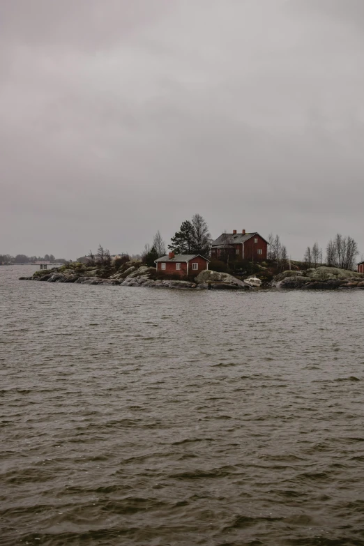 a small island in the middle of a body of water, a picture, inspired by Lars Jonson Haukaness, overcast!!!, helsinki, sweet home, around 1 9 years old