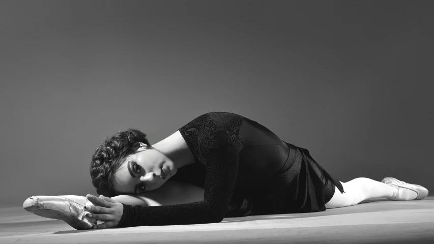 a woman in a leo leo leo leo leo leo leo leo leo leo leo leo leo leo, a black and white photo, arabesque, kiera knightly in repose, nathalie emmanuel, sleepy fashion model face, lying on an abstract