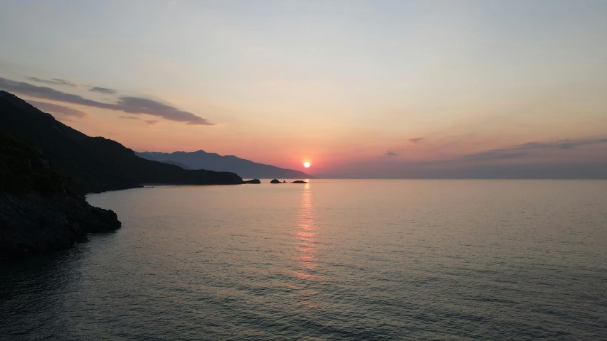 the sun is setting over a body of water, pexels contest winner, greece, slight overcast lighting, instagram post, mediterranean