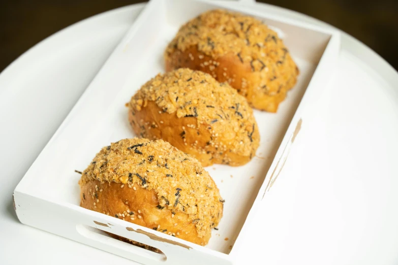 a close up of a box of food on a table, crispy buns, 3 - piece, speckled, 王琛