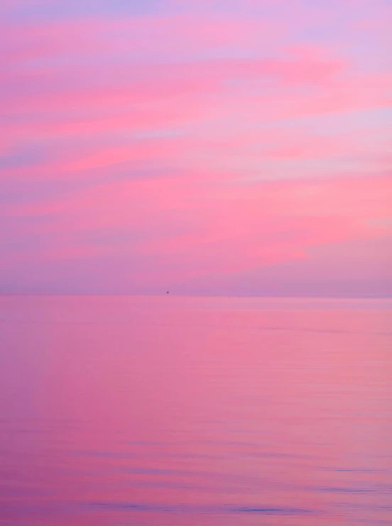 a large body of water with a pink sky in the background, a picture, pink and triadic color scheme, rinko kawauchi, calm seas, like a catalog photograph