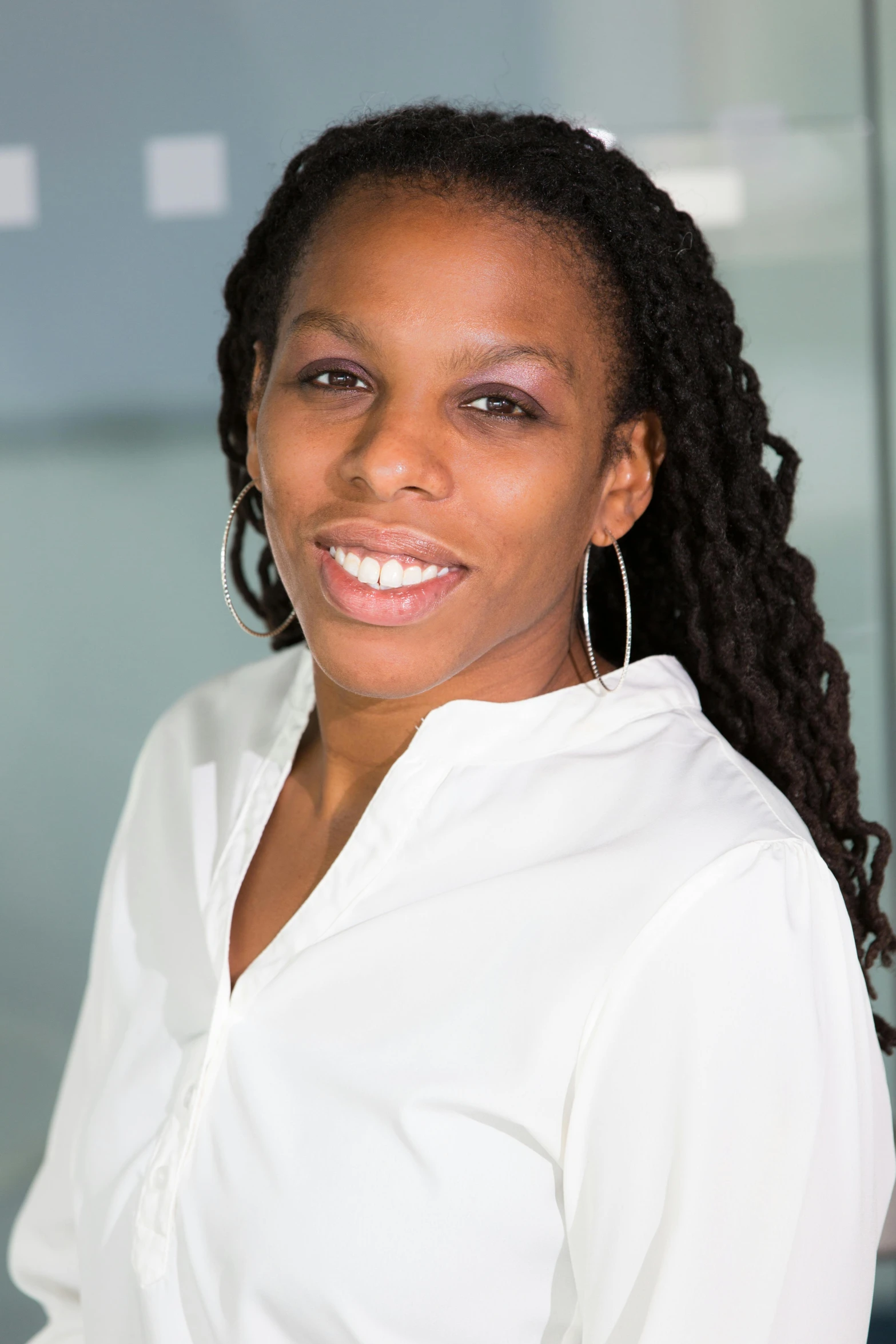 a woman in a white shirt posing for a picture, jamal campbell, head and shoulders shot, high detaild, architect