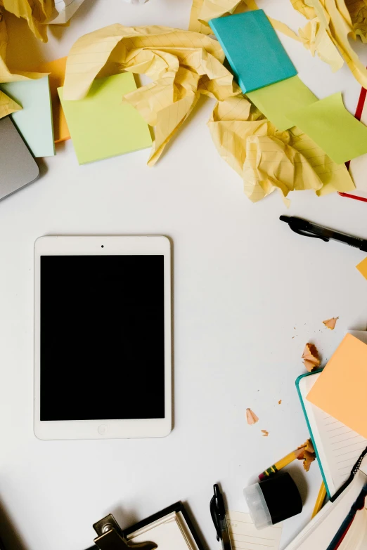 a white tablet computer sitting on top of a white table, trending on pexels, messy lines, square, colorful”, organized