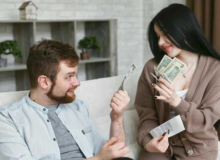 a man and a woman sitting on a couch holding money, pexels contest winner, renaissance, russian girlfriend, profile pic, thumbnail, 1 2 9 7