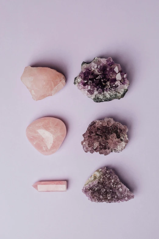 a variety of crystals on a purple background, by Winona Nelson, trending on pexels, aestheticism, pastel pink concrete, on grey background, pink iconic character, pink sunlight