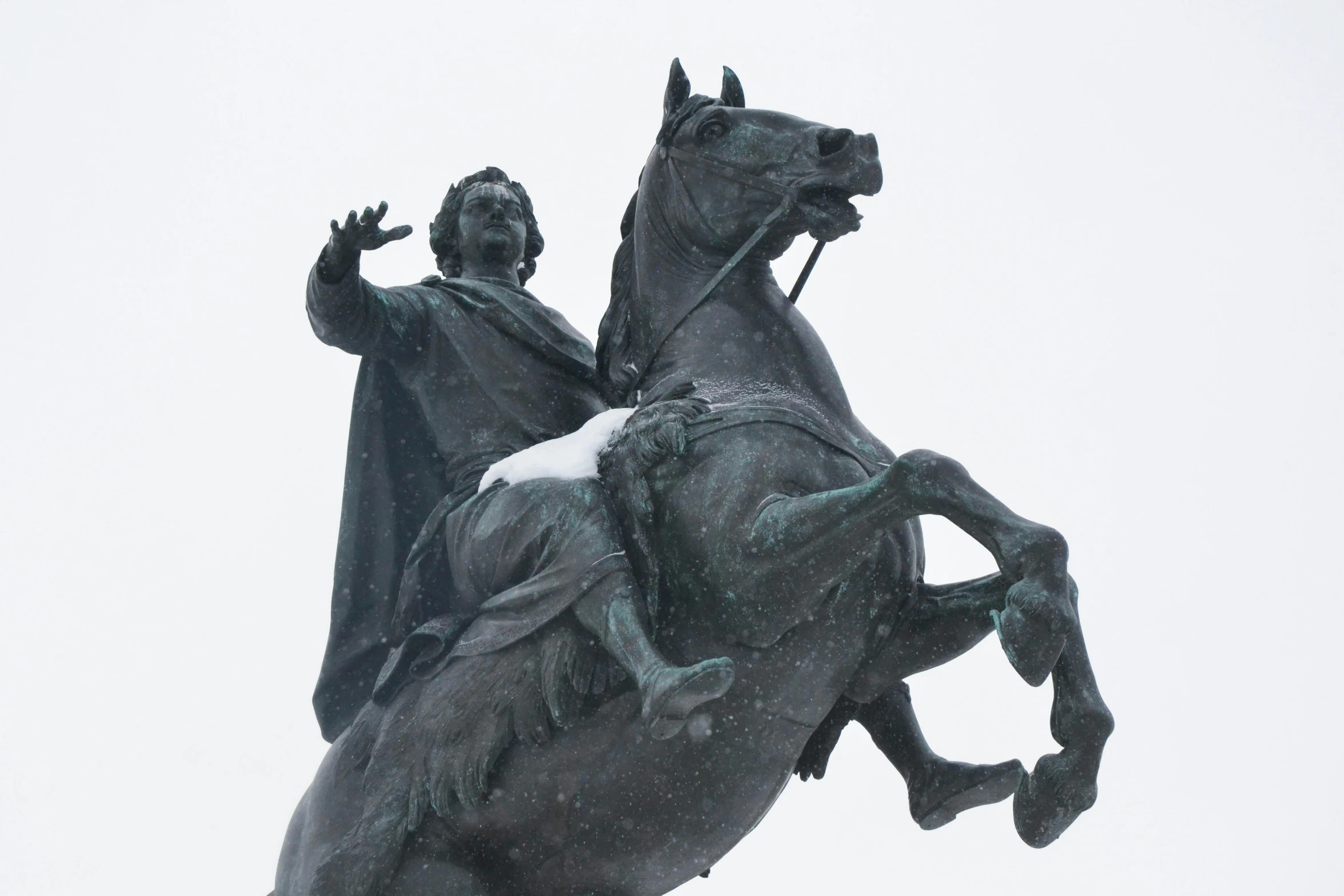 a statue of a man riding on the back of a horse, inspired by Illarion Pryanishnikov, trending on unsplash, snow on the body, square, pointing, grey