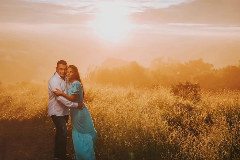 a man and woman standing in a field at sunset, pexels contest winner, avatar image, hazy, hispanic, on a hill