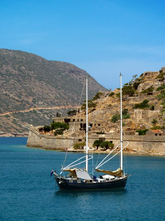 a boat that is sitting in the water, pexels contest winner, ancient mediterranean village, picton blue, impactful, sail