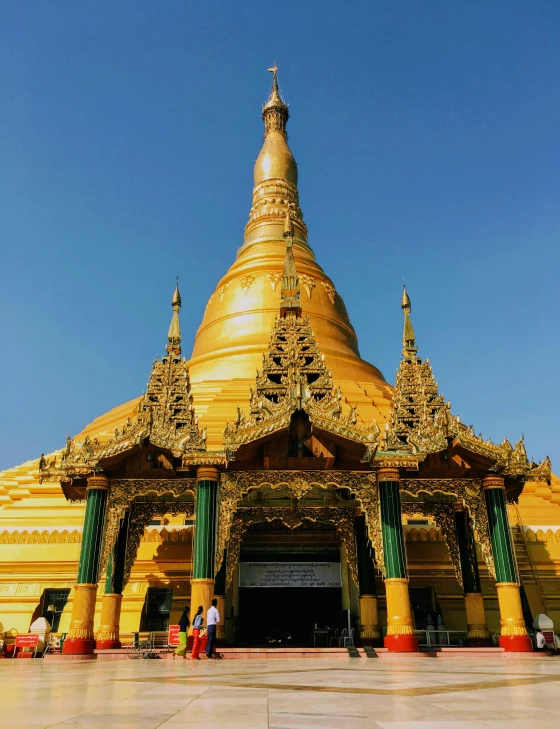 a group of people that are standing in front of a building, pagoda