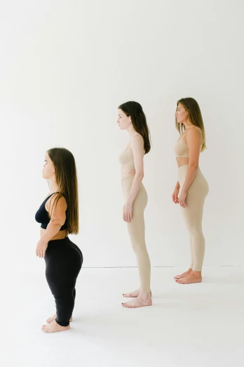 a group of women standing next to each other, inspired by Vanessa Beecroft, renaissance, marjaryasana and bitilasana, looking at each other mindlessly, hip-length, jovana rikalo