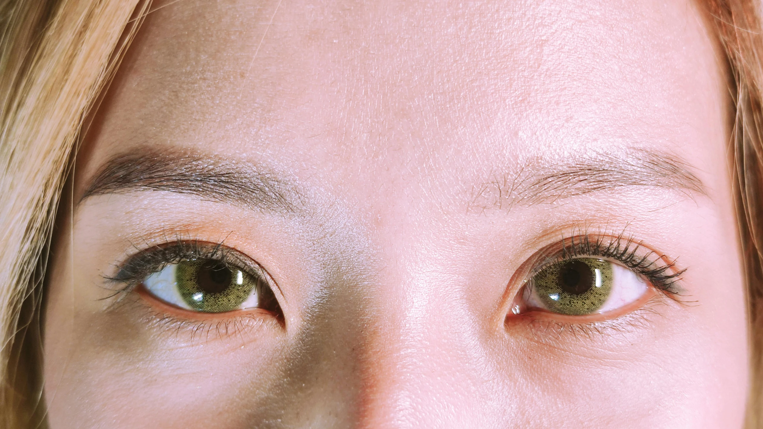 a close up of a woman's face with a tooth brush in her mouth, inspired by Ina Wong, trending on pexels, hyperrealism, jimin\'s right eyelid swollen, green and brown tones, two identical symmetrical eyes, high angle close up shot