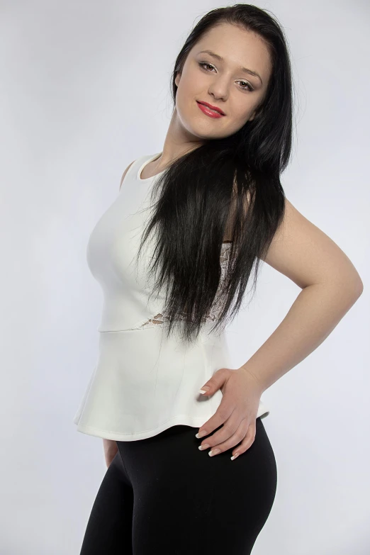 a woman with long black hair posing for a picture, white top, white background : 3, very pale white skin, ameera al-taweel