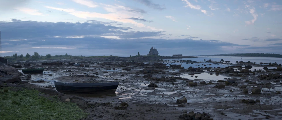 a boat sitting on top of a beach next to a body of water, a detailed matte painting, by Adriaen Hanneman, unsplash, medieval french landscape, twilight ; wide shot, northern france, rock pools