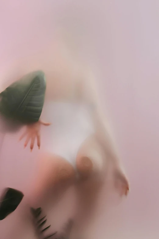 a close up of a flower with a blurry background, an album cover, inspired by Ren Hang, conceptual art, pale pink bikini, ghostly form, leafs, ignant