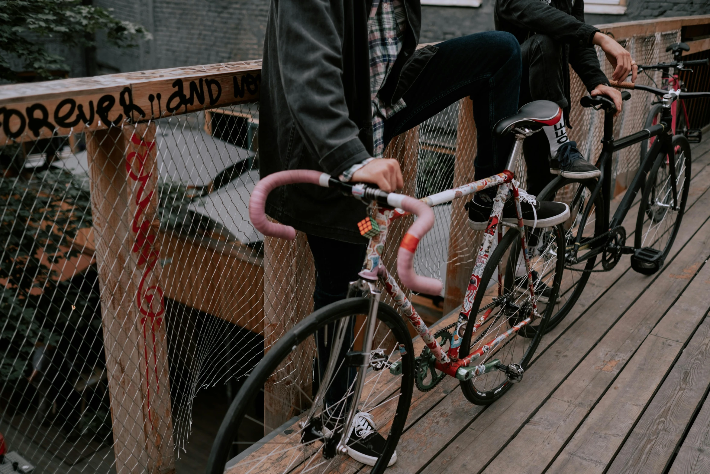 a couple of men sitting on top of a wooden bridge, pexels contest winner, graffiti, cycling!!, zoomed in, 🚿🗝📝, profile image