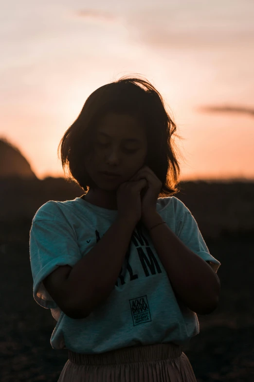 a little girl that is standing in the dirt, inspired by Elsa Bleda, trending on unsplash, happening, portrait of depressed teen, ((sunset)), profile picture 1024px, crossed arms