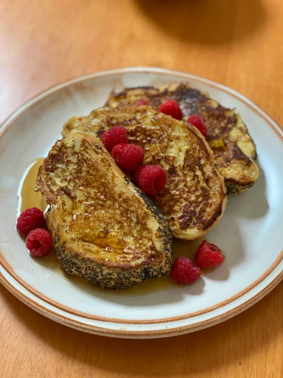a white plate topped with french toast and raspberries, reddit, renaissance, perfect crisp sunlight, orthodox, contest winner 2021, gold speckles