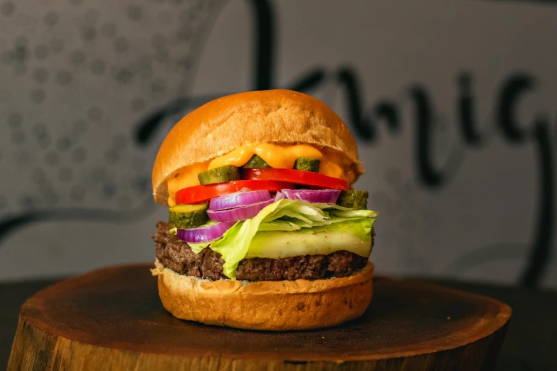 a hamburger sitting on top of a wooden table, profile image