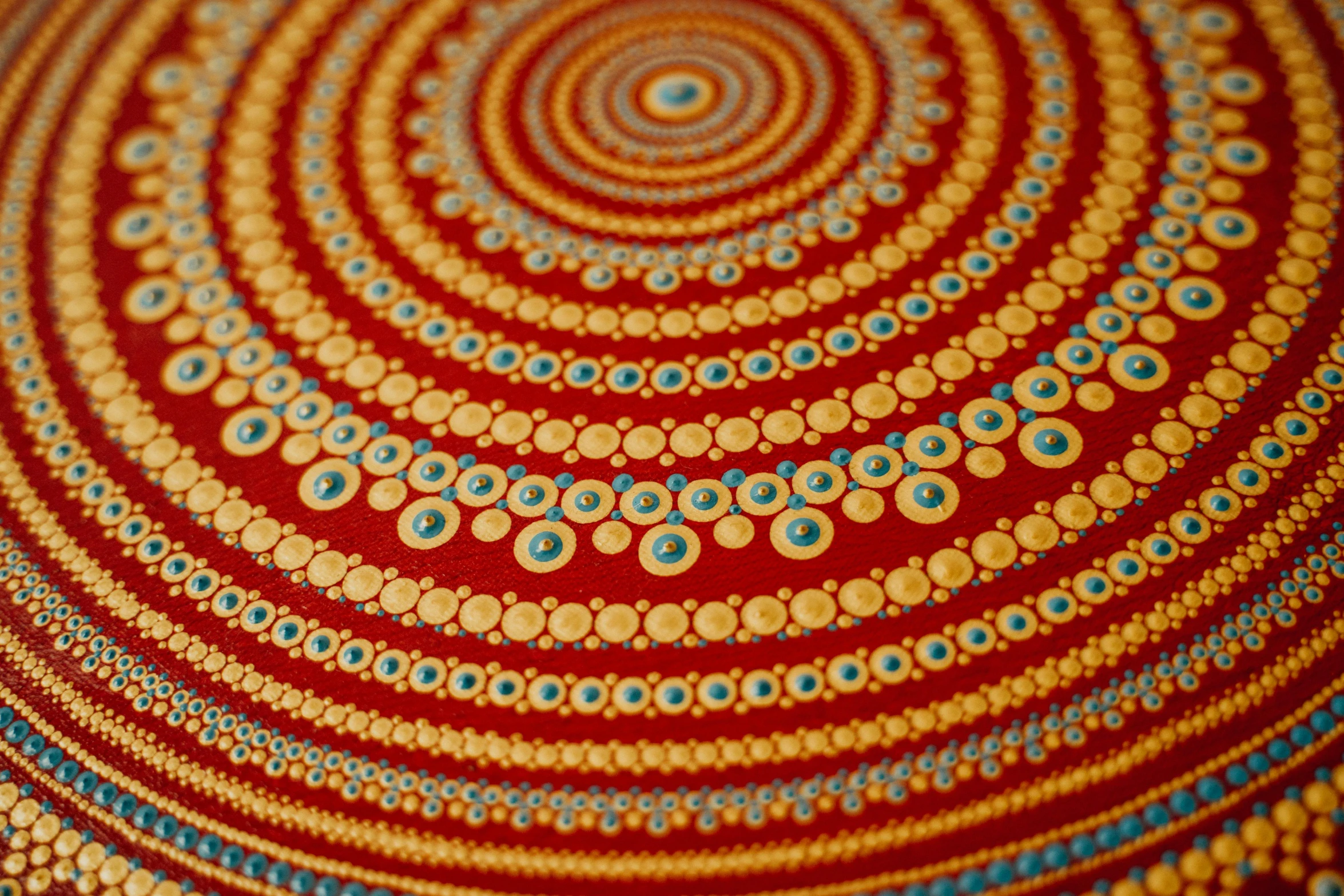 a close up of a painting on a table, a detailed painting, inspired by Kusama, flickr, symmetric indian pattern, samburu, bangalore, round-cropped