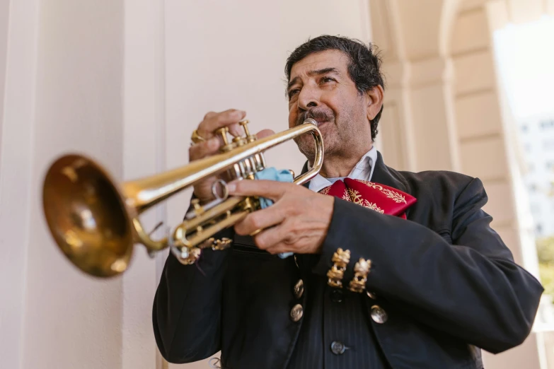 a man in a suit playing a trumpet, by Alejandro Obregón, pexels contest winner, mexican folklore, wearing presidential band, 15081959 21121991 01012000 4k, thumbnail