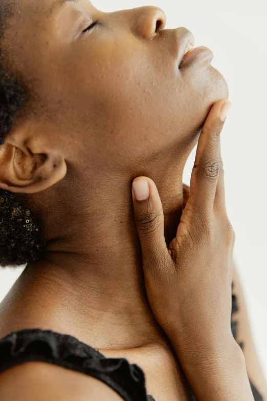 a woman with her hand on her chin, by Carey Morris, trending on pexels, renaissance, square masculine jaw, cysts, neck up, detailed product image