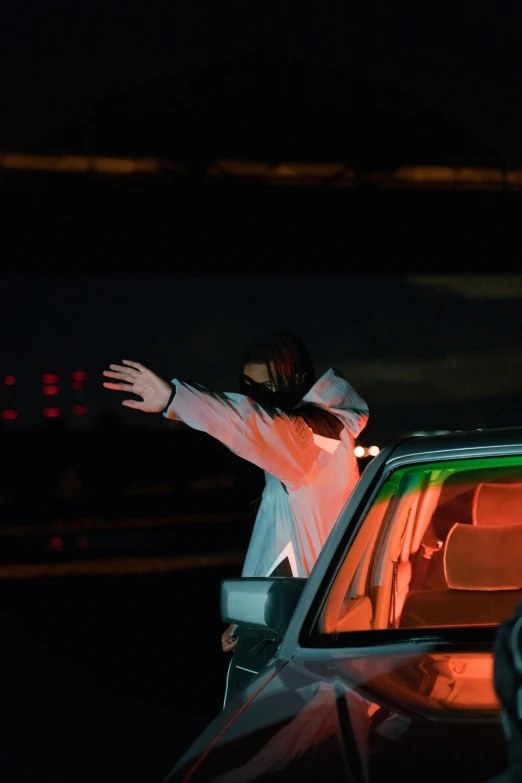 a person with their arms out of the window of a car, flashing lights, off - white collection, production photo, acronym